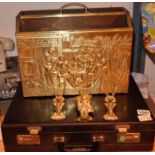 A brass single handled magazine rack, three vintage brass door knockers and a leather effect