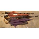 Collection of mixed umbrellas and a pair of walking poles. Not available for in-house P&P, contact