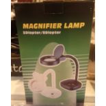 New and boxed magnifier lamp. P&P Group 2 (£18+VAT for the first lot and £3+VAT for subsequent lots)