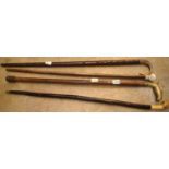 Three decorative ornate canes and a Irish shillelagh. Not available for in-house P&P, contact Paul