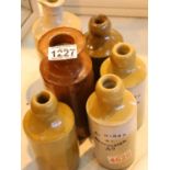 Six earthenware flasks, some marked Hirst Manchester. Not available for in-house P&P, contact Paul