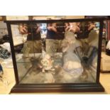 Unusual bisque Alice and March Hare figurines in a mirrored interior cabinet. Not available for in-