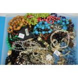 Tray of mixed, unsorted costume jewellery and watches. P&P Group 2 (£18+VAT for the first lot and £