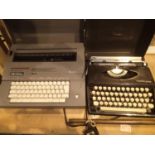 Cased Smith Corona electric typewriter and a retro Tippa 5 manual typewriter. Not available for in-