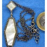 Mother of pearl and marcasite pendant on a silver chain. P&P Group 1 (£14+VAT for the first lot