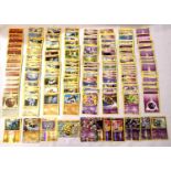 Collection of assorted Fighting and Psychic Pokemon trading cards including shiny / holographic