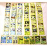 Collection of assorted Water and Grass Pokemon trading cards including shiny / holographic examples;