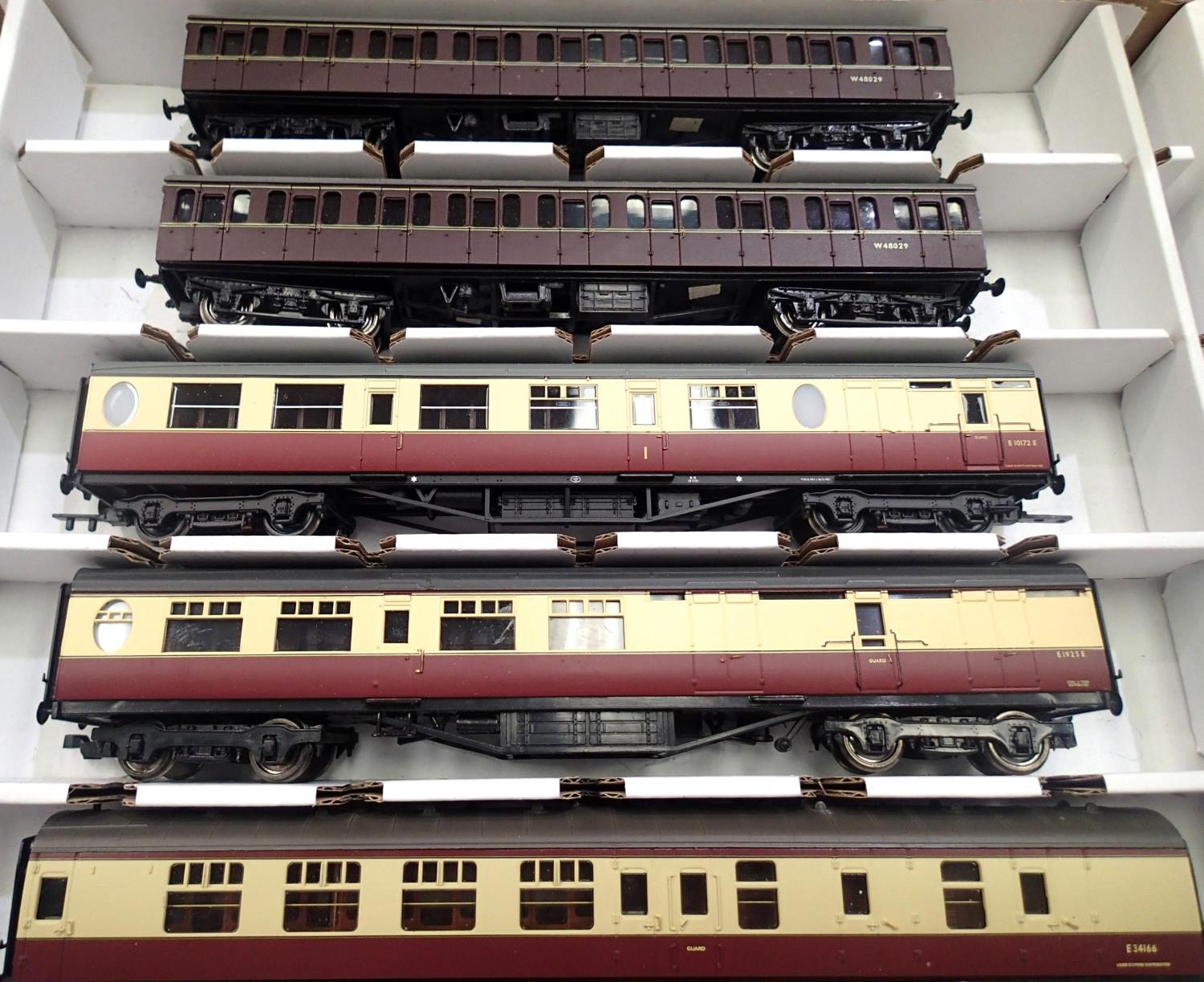Five OO scale coaches, three Carmine/Cream and two BR Maroon Suburbans in very good condition, in