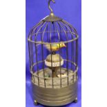Clockwork bird clock in a cage, H: 22 cm. Working at lotting. P&P Group 3 (£25+VAT for the first lot