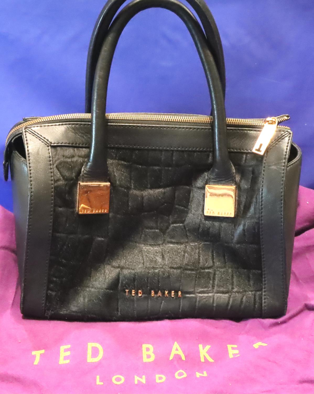 Black leather handbag by Ted Baker, with dust cover, L: 29 cm. P&P Group 2 (£18+VAT for the first