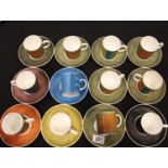 Twelve Wedgwood Susie Cooper coffee cans and saucers in the Nebula pattern. No cracks, chips or