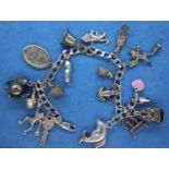 925 silver charm bracelet, 17 charms, L: 21 cm. P&P Group 1 (£14+VAT for the first lot and £1+VAT