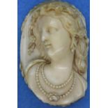 Carved ivory female portrait, unmounted, H: 7 cm. P&P Group 1 (£14+VAT for the first lot and £1+