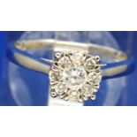 9ct white gold ring set with larger central diamond and eight smaller diamonds, total 0.25ct, size