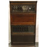 Four section Globe Wernicke bookcase with shelved storage cupboard and fitted bureau, 88 x 36 x