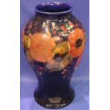 Large Moorcroft Baluster vase, blue ground in the pomegranate pattern, H: 33 cm. Possible