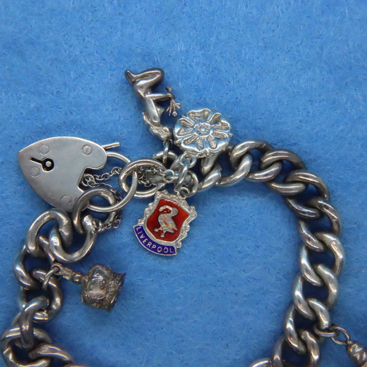 Silver charm bracelet with seven charms. P&P Group 1 (£14+VAT for the first lot and £1+VAT for - Image 4 of 6