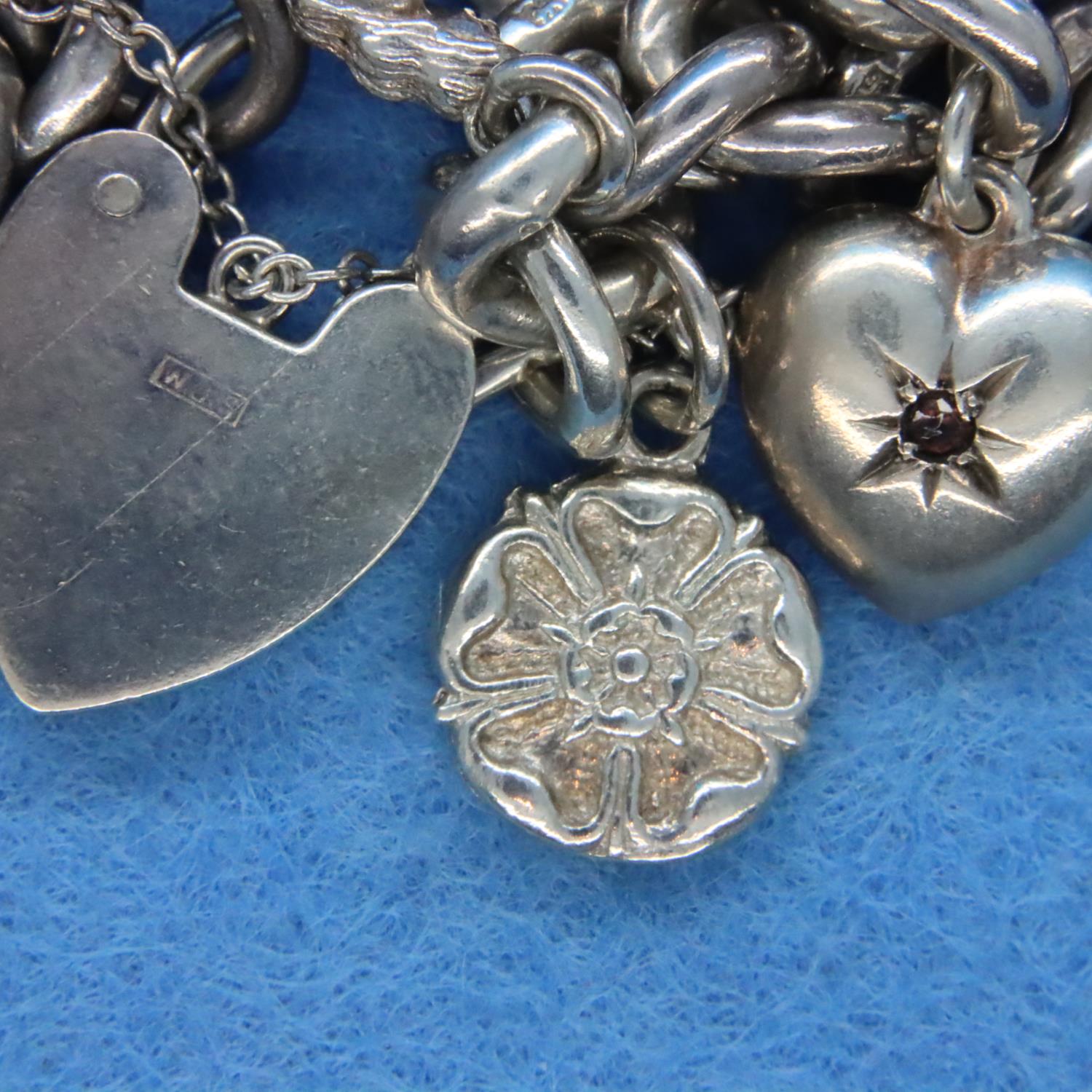 Silver charm bracelet with seven charms. P&P Group 1 (£14+VAT for the first lot and £1+VAT for - Image 6 of 6