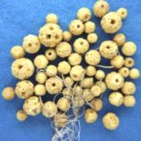Set of antique carved ivory beads, largest bead D: 12 mm. P&P Group 1 (£14+VAT for the first lot and