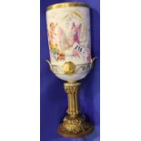 Large Continental hand painted vase featuring cherubs on a butterfly chariot, bolted to a later