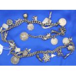 Unusual hallmarked silver charm necklace, (30 charms) chain L: 56 cm, combined 109g. Few charms