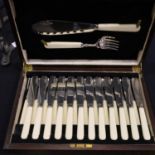 Cased set of twelve fish knives and forks and servers with bone handles. Not available for in-