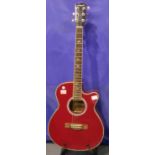 Martin Smith red acoustic guitar, scratches throughout and damages to headstock. Not available for