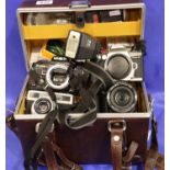 Five cameras and various accessories to include a Minolta Dynax 5, Pentax Optio, Minolta X300 etc.