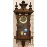 Enamel and brass face chiming wall clock with key and pendulum, L: 78 cm. Not available for in-house