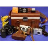 Case containing five cameras and various accessories, to include Canon Powershot, Canon EOS10. P&P