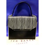 Black and cream striped leather handbag by Ted Baker, with strap and dust cover, L: 24 cm. P&P Group