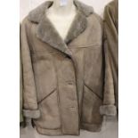 Ladies new sheepskin coat, made in England, size M. P&P Group 3 (£25+VAT for the first lot and £5+