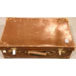 Large brown leather suitcase, stamped A.G.G., 66 x 22 x 40 cm. Not available for in-house P&P,