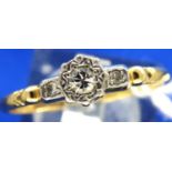 18ct gold and platinum set solitaire illusion diamond ring with diamond shoulders, size T/U, 2.4g.