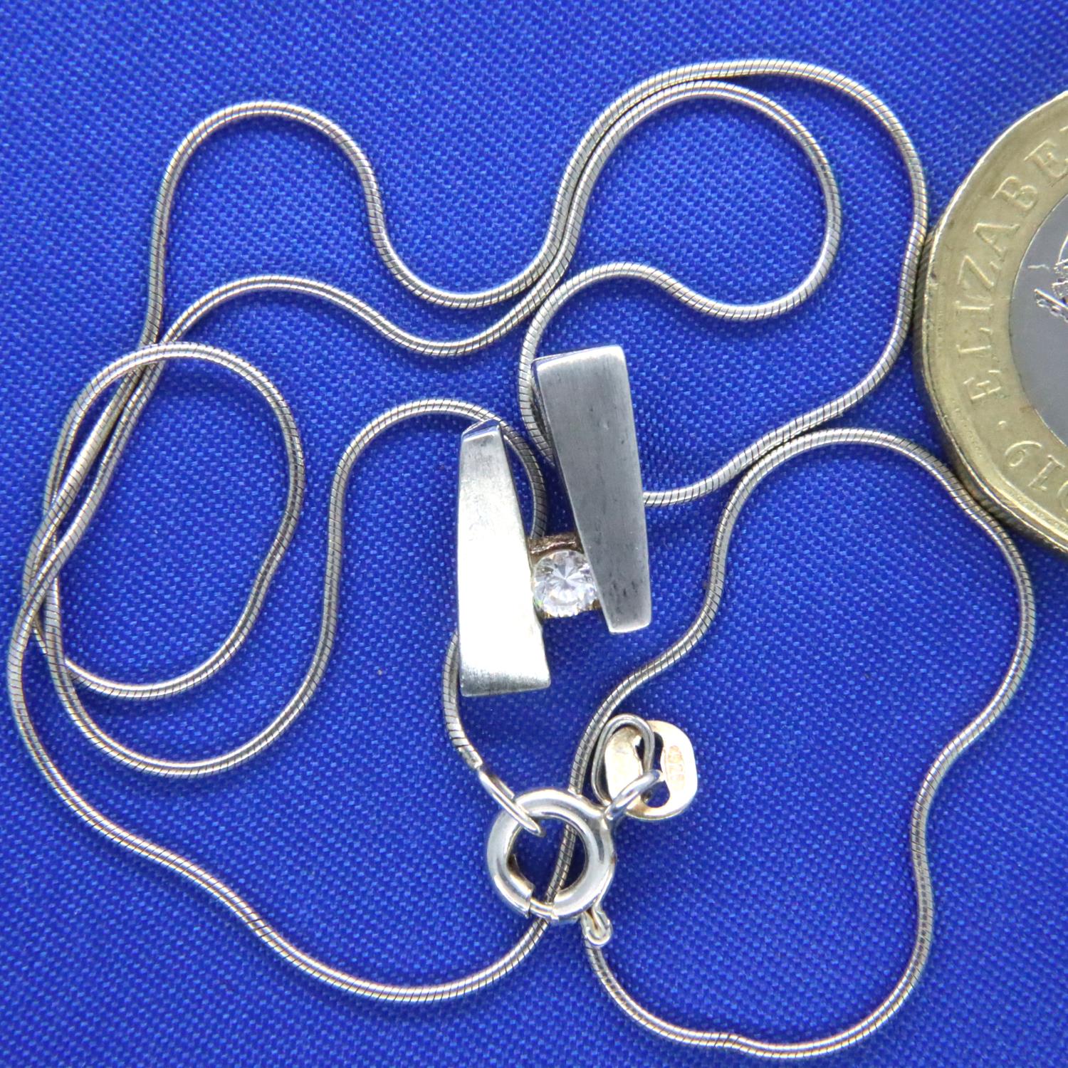 Sterling silver neck chain with a diamond set pendant, chain L: 38 cm, pendant D: 14 mm. P&P Group 1