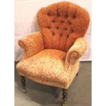 Modern upholstered button back armchair with some fading, H: 94 cm. Not available for in-house P&
