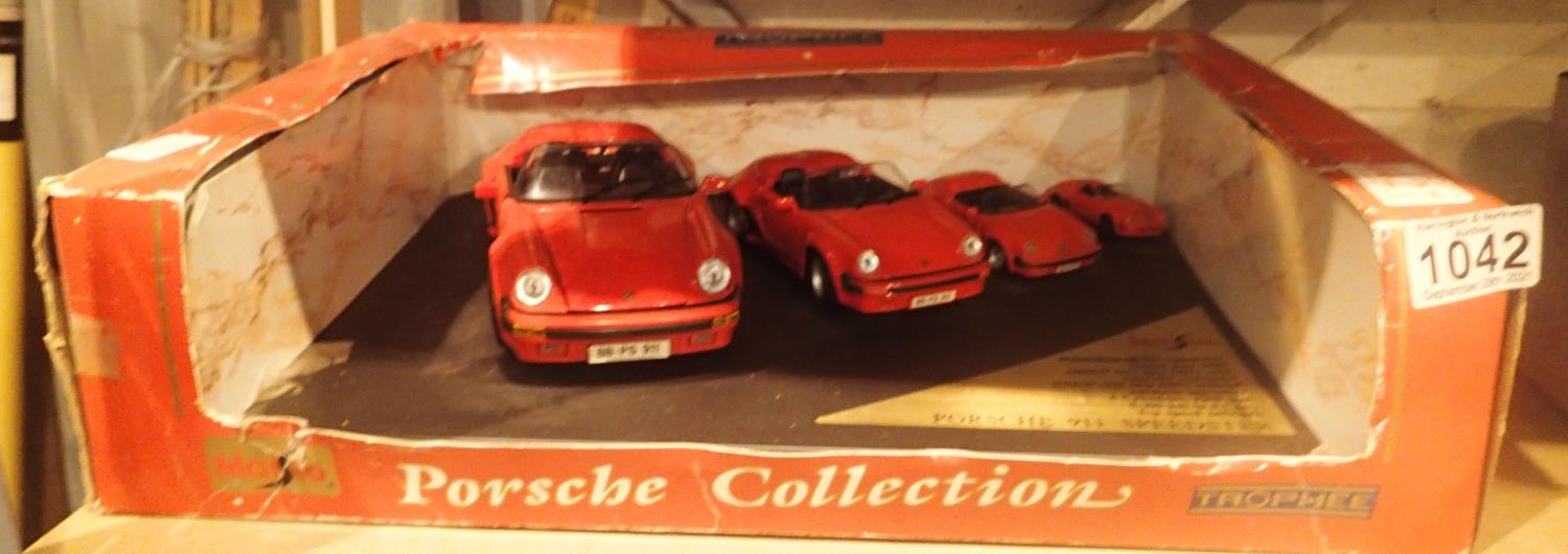 Boxed set of four model Porsche cars. P&P Group 2 (£18+VAT for the first lot and £3+VAT for