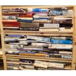 Two shelves of mixed books including A Concise History Of Photography. Not available for in-house