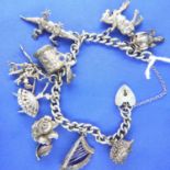 Sterling silver charm bracelet, nine charms, L: 18 cm, 55g. P&P Group 2 (£18+VAT for the first lot