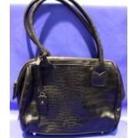 Black crocodile effect handbag by M&S with dust cover, L: 32 cm. P&P Group 2 (£18+VAT for the