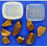Two loose intaglio seals and a collection of polished tigers eye. P&P Group 1 (£14+VAT for the first