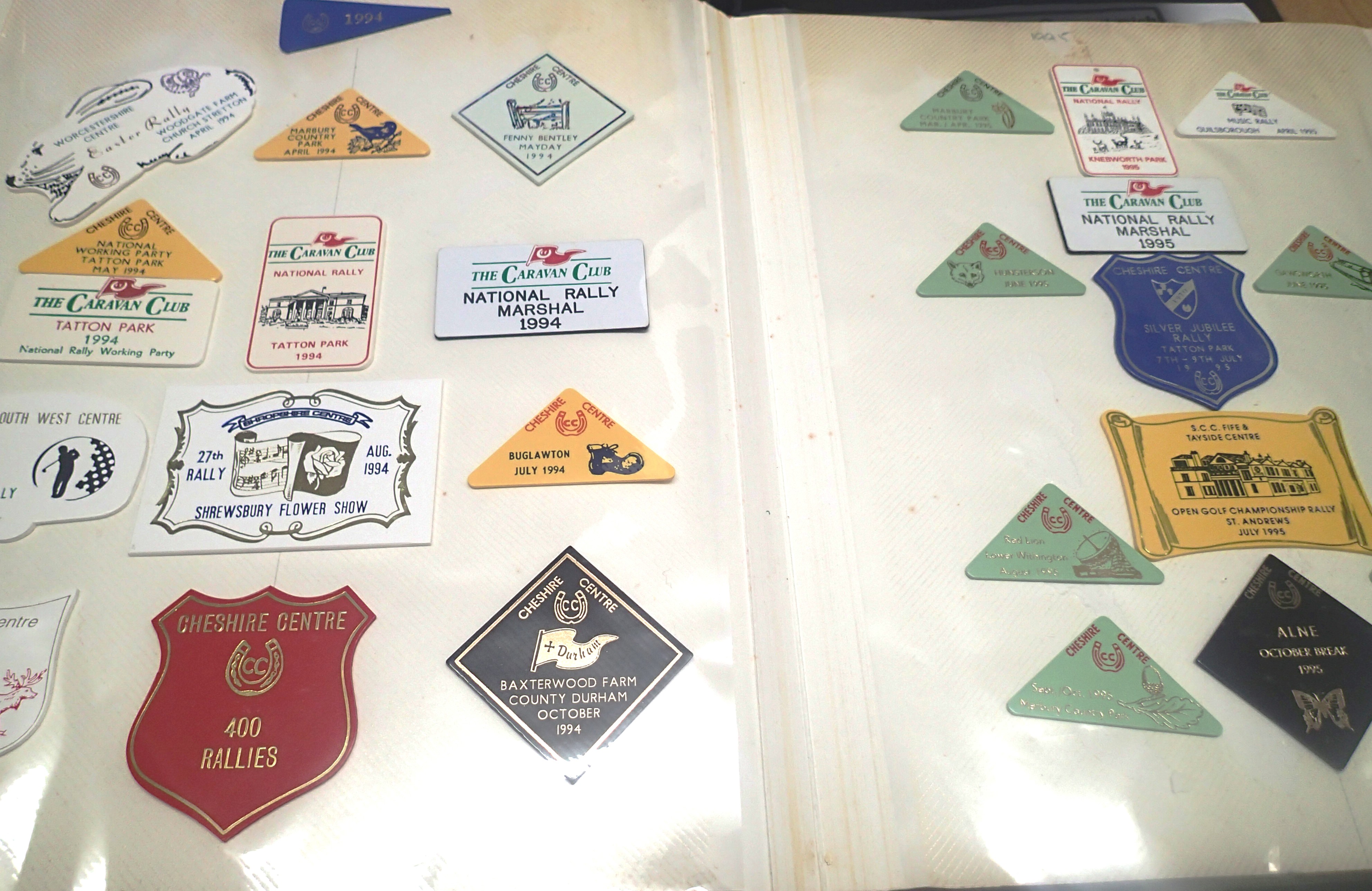 An album containing a large quantity of Caravan Club Rally badges, from 1970 -1990s. P&P Group 2 (£