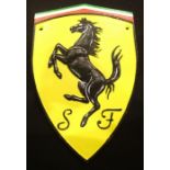 A cast iron Ferrari badge wall plaque, 20 x 30 cm. P&P Group 2 (£18+VAT for the first lot and £3+VAT