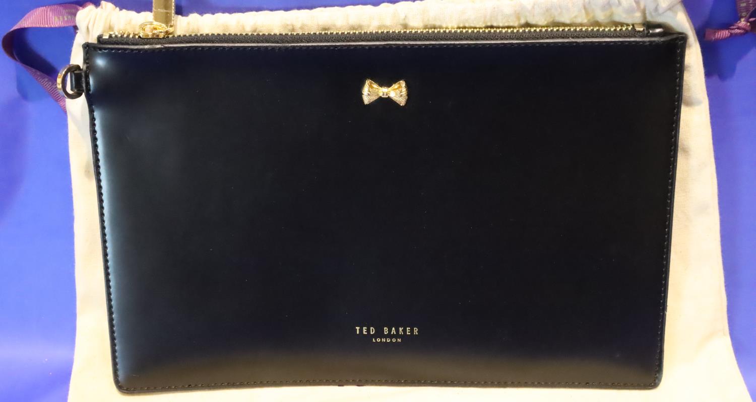 Black leather Ted Baker bag with zipper top and dust cover, L: 27 cm. P&P Group 2 (£18+VAT for the