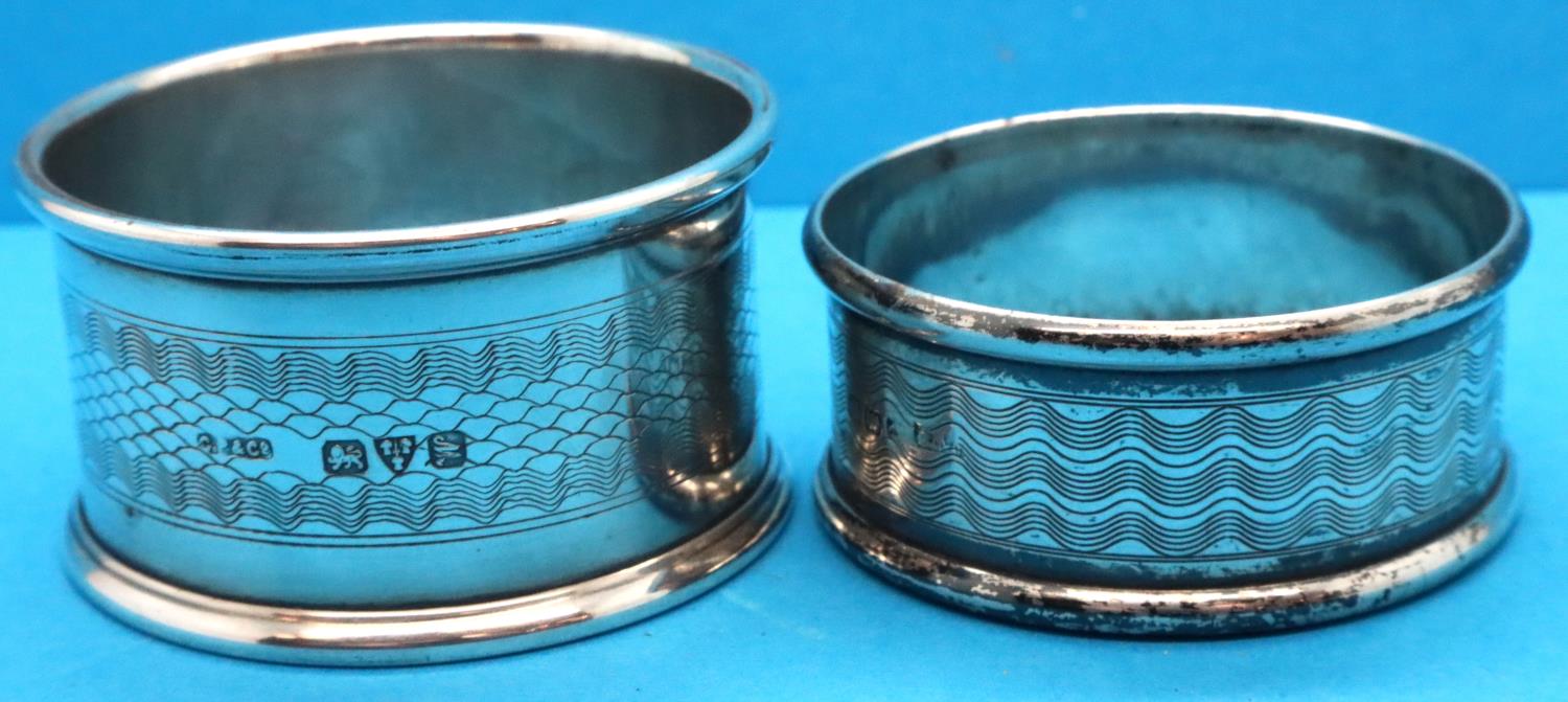 Two hallmarked silver napkin rings, 22g, different hallmarks. P&P Group 1 (£14+VAT for the first lot