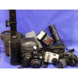 Collection of cameras lenes and camera cases including Cobra 700af Nikon AF flash Ohara zoom slide