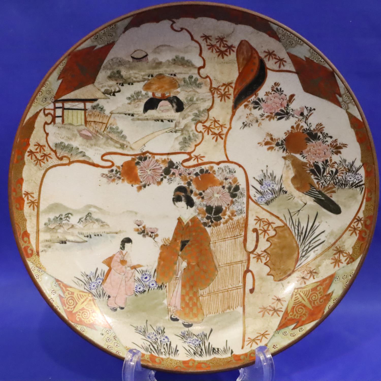 Japanese vintage dish depicting a Geisha in garden, D: 24 cm. Some crazing otherwise no damage. P&