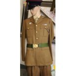The Merlian regiment uniform, comprising tunic with ribbon bar, belt, trousers and cap with lanyard.