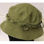 Vietnam War period jungle hat with grenade rings. P&P Group 2 (£18+VAT for the first lot and £3+