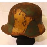 WWI 1916 German Stahlhelm helmet, painted in jigsaw pattern camouflage, complete with leather liner.